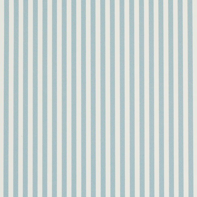 Emma Stripe Narrow wallpaper in Chambray by Schumacher, featuring crisp blue and white vertical stripes, shown in a bathroom setting.