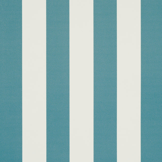 Emma Stripe Azure wallpaper by Schumacher featuring bold blue and white vertical stripes, shown in a styled bathroom interior.