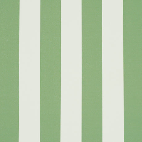 Emma Stripe wallpaper in Apple Green by Schumacher, featuring bold vertical green and white stripes, shown in a styled bathroom interior.
