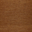 Osan Sisal dark camel natural grasscloth wallpaper by Schumacher, shown in a close-up and installed in a living room interior.