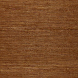 Osan Sisal dark camel natural grasscloth wallpaper by Schumacher, shown in a close-up and installed in a living room interior.