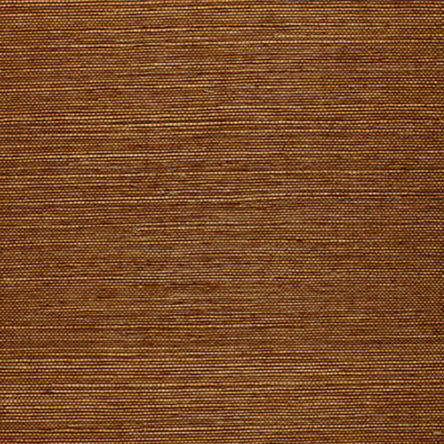 Osan Sisal dark camel natural grasscloth wallpaper by Schumacher, shown in a close-up and installed in a living room interior.