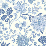 Alicia wallpaper by Boråstapeter for Schumacher, blue and white stylized floral pattern, shown in a bright living room setting.