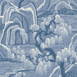 Indigo Garden wallpaper by Boråstapeter for Schumacher, featuring blue and white rolling hills, willow trees, and water in a scenic landscape.