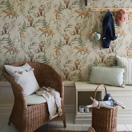 Wild Forest wallpaper in sage by Boråstapeter for Schumacher, featuring hand-painted bears and foxes amid greenery in a Nordic forest scene.