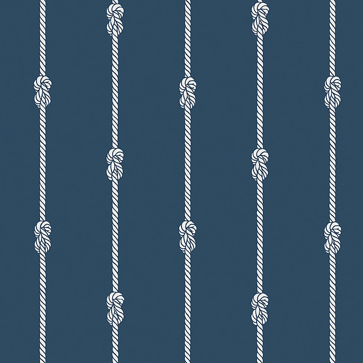 Navy blue wallpaper with vertical white nautical rope stripes and figure-eight knots, styled in a coastal interior setting.