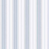 Hamnskär Stripe blue and white nautical striped wallpaper by Boråstapeter for Schumacher, shown in a bedroom interior.