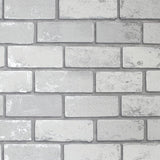 Myron Dove Metallic Brick Wallpaper roll in pale grey and white with subtle silver highlights