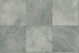 Seabrook Designs Kemi wallpaper in Blueberry, a matte Type II vinyl with geometric tile-like woodgrain rings in gray-blue tones.