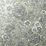 Hedgerow Green floral trails wallpaper with charcoal botanical illustration on soft green background.