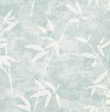 Honshu Bamboo wallpaper in a soft blue (Lakeside) with white bamboo leaf silhouettes and a mottled matte background.