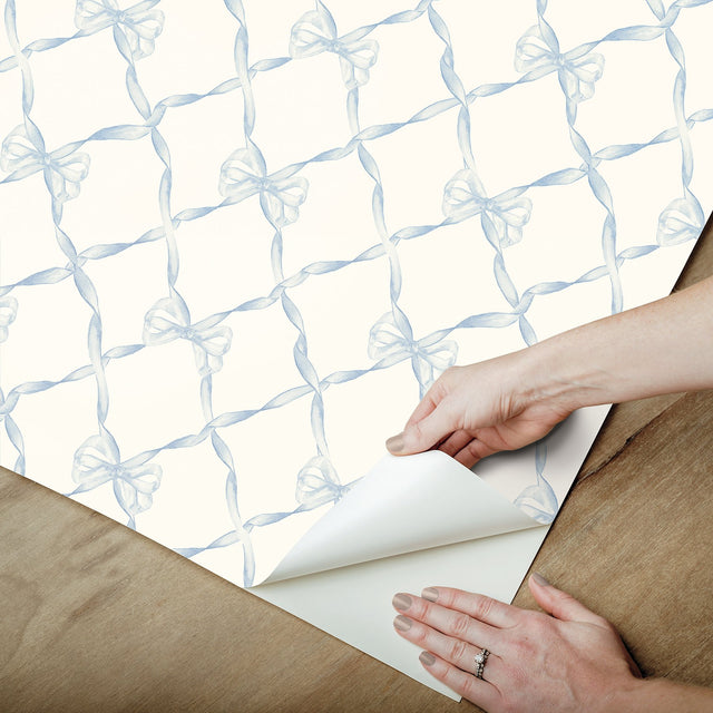Baby Bow Dreamy Sky Peel & Stick Wallpaper with Whimsical Blue Ribbon Trellis - NuWallpaper LFS5013
