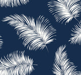 Navy blue peel and stick wallpaper with white tossed palm fronds (Tossed Palm pattern).