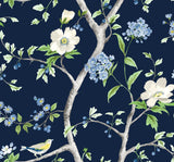 Floral Trail peel and stick wallpaper in navy blue with spring green branches, white and blue flowers, and small birds