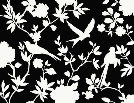 Kauai Bird Toile wallpaper in Inkwell featuring white bird and floral toile silhouettes on a black ground