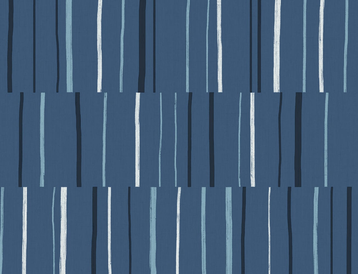 Block Lines geometric wallpaper with staggered vertical brushstroke stripes in blueberry, midnight, and pale blue on a matte ground.