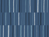 Block Lines geometric wallpaper with staggered vertical brushstroke stripes in blueberry, midnight, and pale blue on a matte ground.