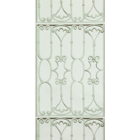 St. Germain Moss wallpaper by Raoul Textiles for Schumacher, featuring an artisanal hand-printed pattern reminiscent of decorative wrought iron in soft green tones.