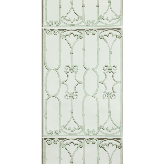 St. Germain Moss wallpaper by Raoul Textiles for Schumacher, featuring an artisanal hand-printed pattern reminiscent of decorative wrought iron in soft green tones.