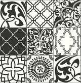 Black and white graphic tile peel and stick wallpaper with mixed Moroccan-inspired motifs.