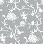 Chinoiserie Silhouette peel and stick wallpaper in metallic silver with white floral branches and swinging figures