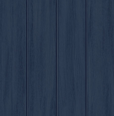 Naval blue wood panel peel and stick wallpaper with vertical planks
