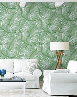 Tossed Palm Fronds Green and White by NextWall Peel & Stick Tropical Palm Fronds Peel & Stick Vinyl Wallpaper – NextWall NW51904