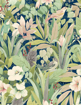 Blossoming Birds peel and stick wallpaper with lush green foliage, pale blossoms, and perched birds on a deep blue background.