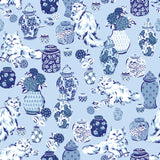 Fancy Cats Blue Peel and Stick Wallpaper by NuWallpaper featuring fluffy white cats and classic blue and white ginger jar pottery on a light blue background