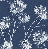 One O'Clock botanical wallpaper in denim blue with white floral silhouettes