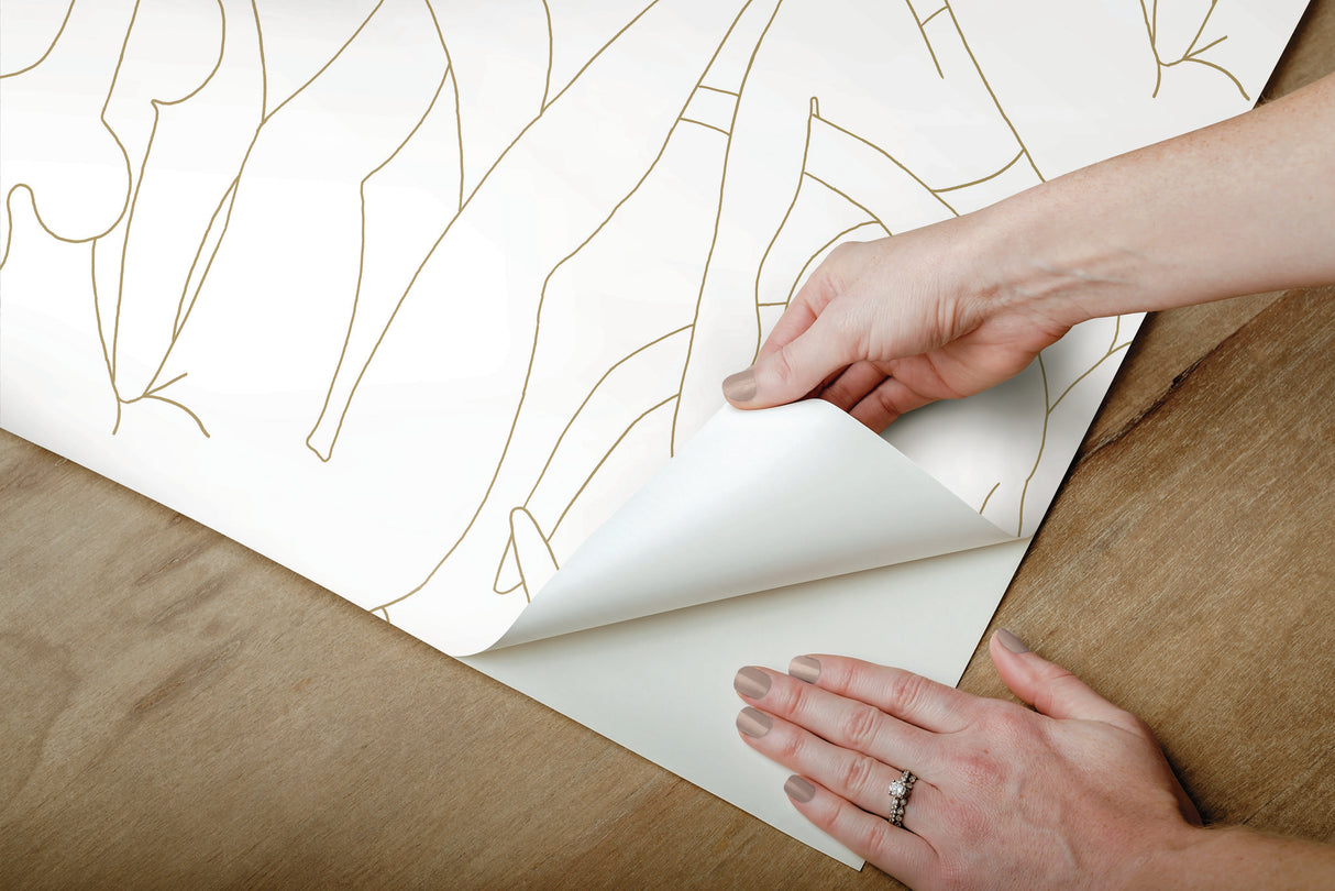 Head over Heels Gold Metallic Peel & Stick Wallpaper with Line Art Figure Motif - York PSW1257RL