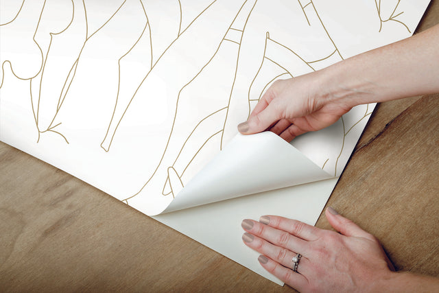 Head over Heels Gold Metallic Peel & Stick Wallpaper with Line Art Figure Motif - York PSW1257RL