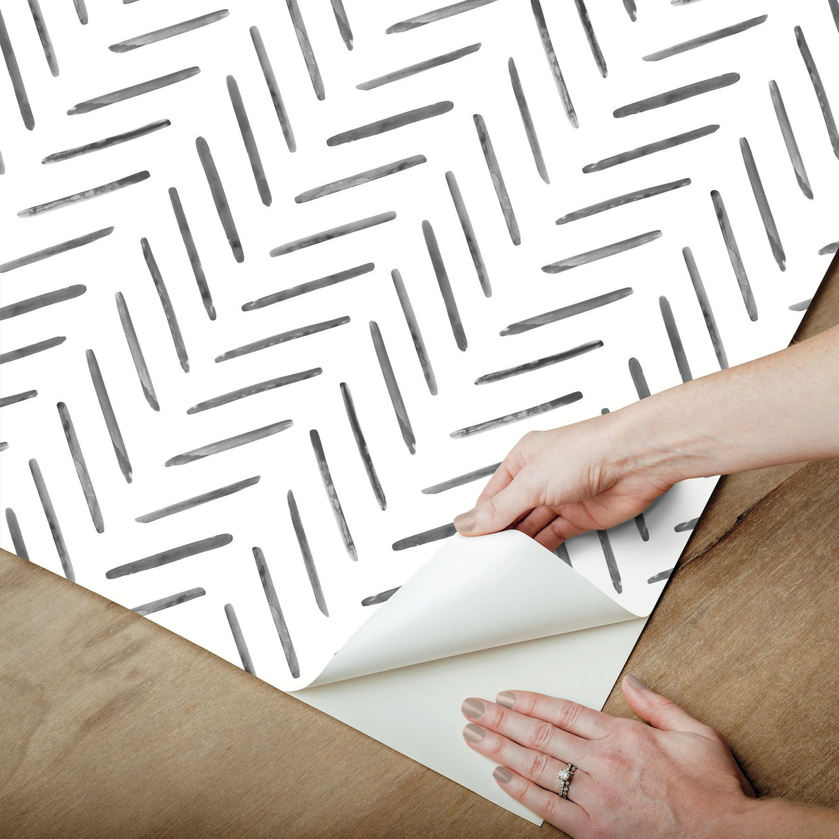 Painted Herringbone Black Peel & Stick Wallpaper with Matte Non-Woven Chevron Pattern - York PSW1525RL
