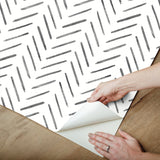 Painted Herringbone Black Peel & Stick Wallpaper with Matte Non-Woven Chevron Pattern - York PSW1525RL