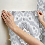 Bohemian Ikat Grey Peel & Stick Wallpaper with Botanical Leaves Pattern, Tropical Style - York RMK12250PLW