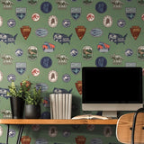 Jurassic World Badges Green Peel & Stick Wallpaper with Retro Dinosaur Patch Motif - York RMK12396RL