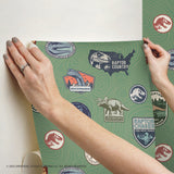 Jurassic World Badges Green Peel & Stick Wallpaper with Retro Dinosaur Patch Motif - York RMK12396RL