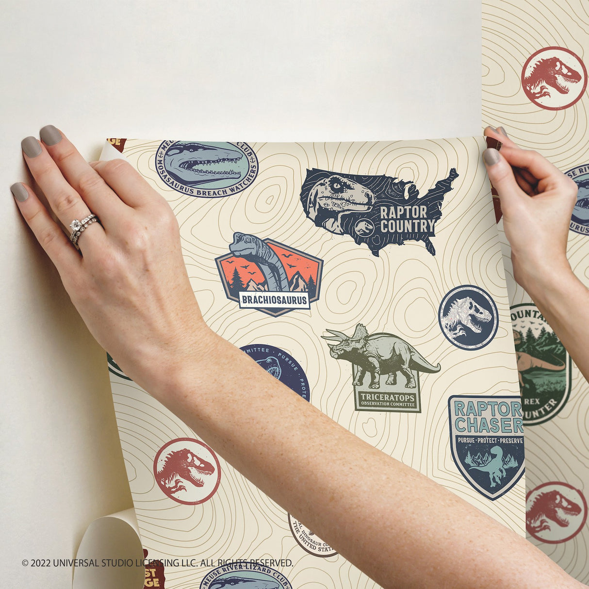 Jurassic World Badges Multicolor Peel & Stick Vinyl Wallpaper with Retro Dinosaur Patch Motif - York RMK12397RL