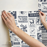 Jurassic World: Dominion Signs Blue Peel & Stick Wallpaper with Dinosaur Warning Sign Motif - York RMK12462RL