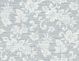 Juno Island Floral wallpaper in Fantasy Blue with coastal floral silhouette on a textured horizontal ground