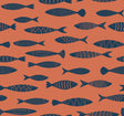 Coastal fish pattern wallpaper in coral orange with navy fish silhouettes.