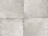 Metallic grey faux tile wallpaper with a subtle mottled texture.