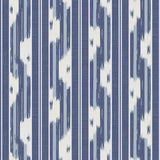 Ojai Blue Peel and Stick Wallpaper featuring a blue and white ikat-inspired vertical stripe pattern by NuWallpaper for Waverly